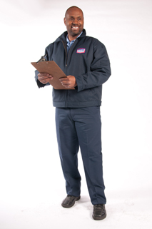 AAMCO offers the best in Muffler and Exhaust System Repairs! Image of smiling AAMCO Mechanic with Clipboard